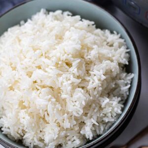 White rice in a blue bowl.