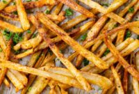 Baked fries on a baking sheet.
