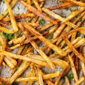 Baked fries on a baking sheet.